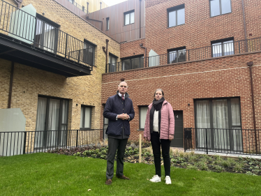 Leo with Cllr Marina Munro outside Pinehurst Hill Side